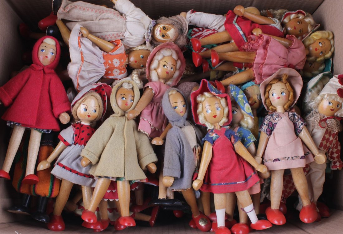 Eighty-eight Polish wooden dolls, each with wig,