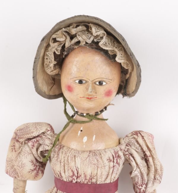 An early 19th century painted wooden doll, with i