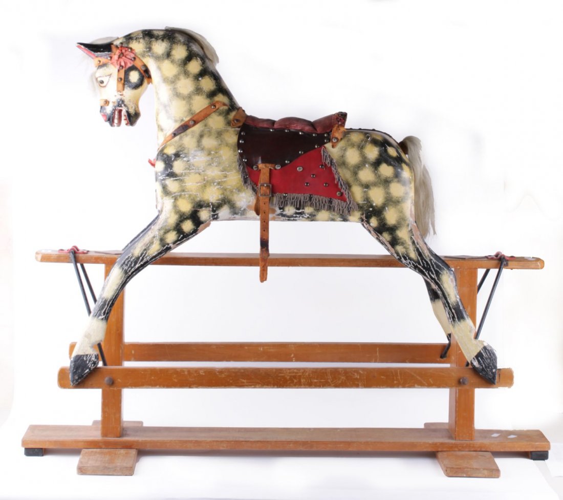 A mid 20th century Collinson carved wooden rocking