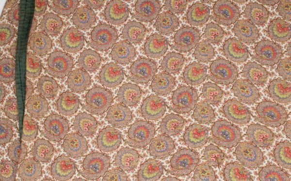 A large 19th century quilt, the paisley design of