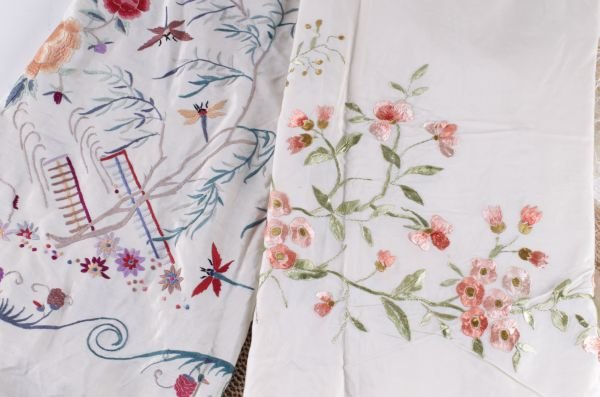 An early 20th century large embroidered cream silk