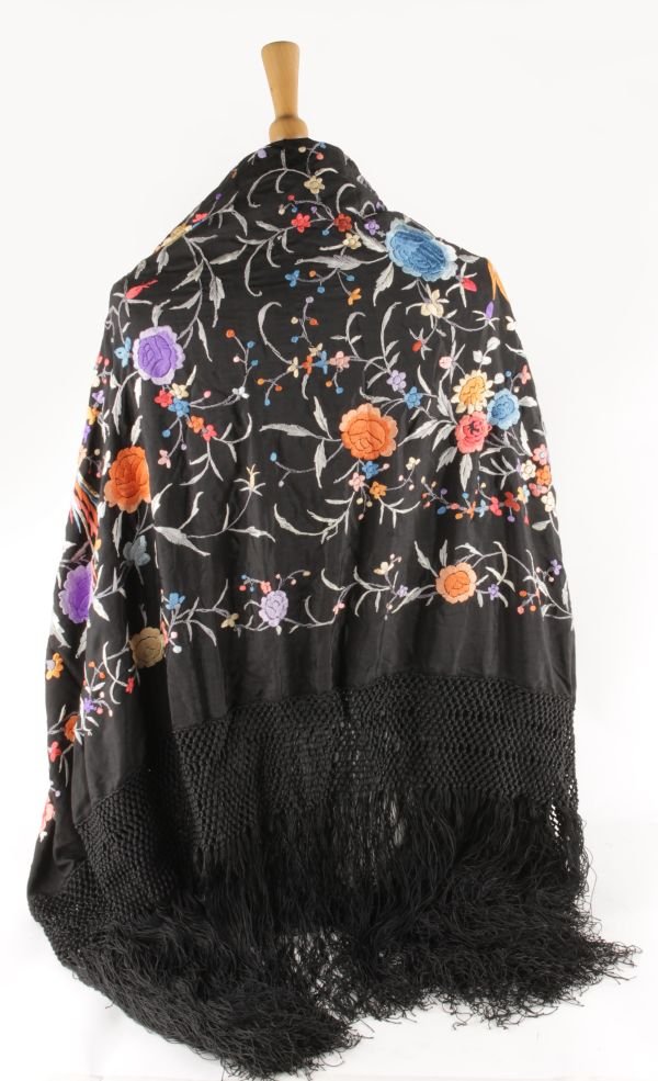 A Chinese black ground silk shawl with floral embr