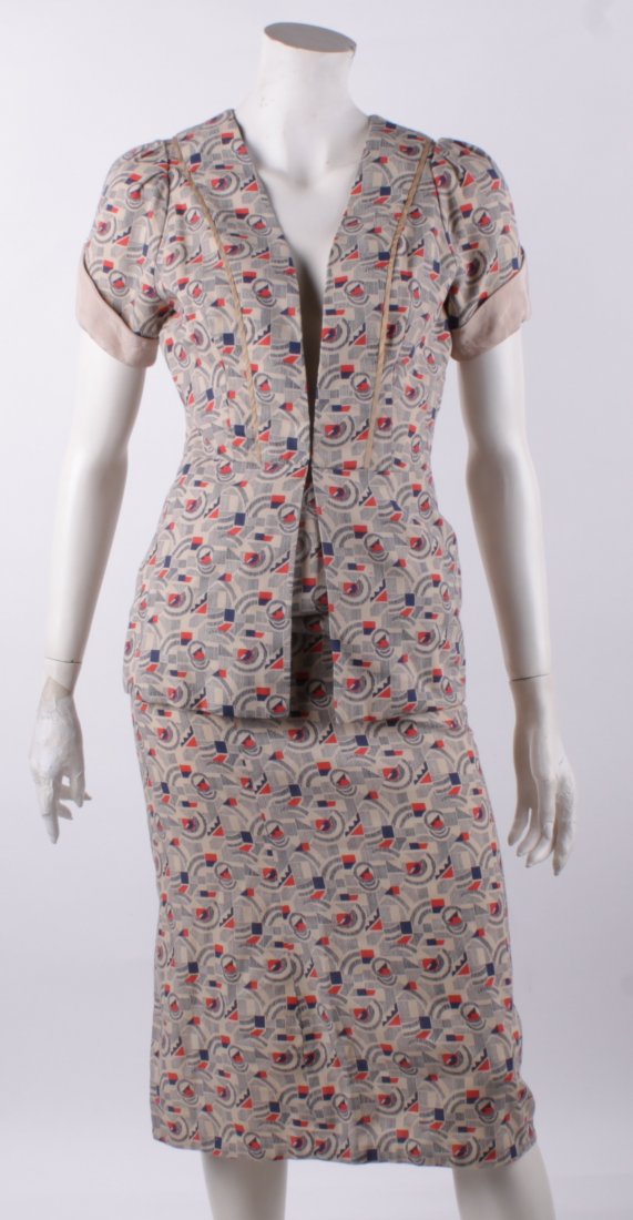 A 1930s geometric print two-piece outfit; a black