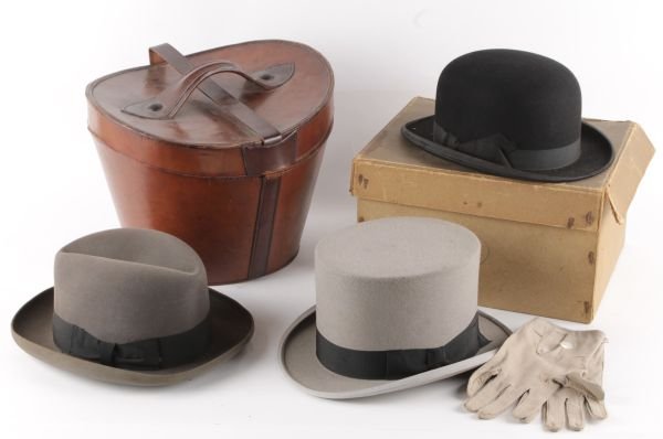 A Dunn and Co. grey top hat and leather gloves, in