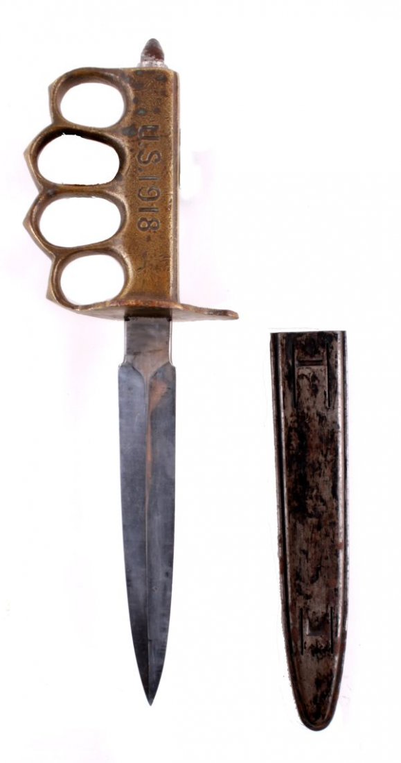 A Great War U.S. 1918 Mark 1 Trench Knife Aulion ,: A Great War U.S. 1918 Mark 1 Trench Knife Aulion, of French manufacture, standard production specification, bearing the lion mark to the ricasso of the bright finished blade, in its steel scabbard.