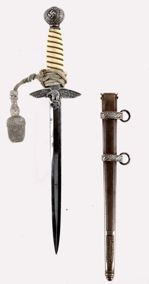 A Model 1937 Luftwaffe Officer's Dagger by A. Sch: A Model 1937 Luftwaffe Officer's Dagger by A. Schuttel Hofer & Co. (Asso) plain nickel-plated blade etched with maker's logo at the ricasso, aluminium cross-guard and pommel, orange coloured