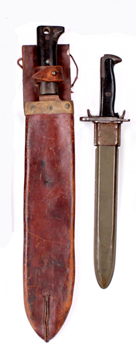 A Second World War U.S. Airborne or Marines Collin: A Second World War U.S. Airborne or Marines Collins Machete - Fighting Knife, regulation pattern, bearing Legitimus Collins maker's mark at the ricasso 'No.1250' dated 1944, in its brown leather scabb