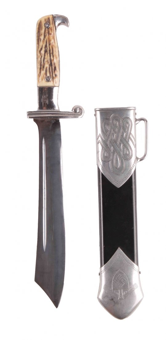 A Model 1934 Hewer for Enlisted Men/NCO's of the RAD: A Model 1934 Hewer for Enlisted Men/NCO's of the RAD the large blade with no etched motto, silver-plated hilt with staghorn grip plates, in its black scabbard with nickel-plated fittings, length 38cm.