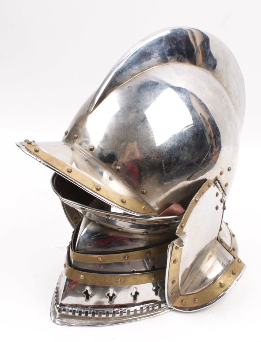 A Reproduction Close-Helmet, with a one-piece skull: A Reproduction Close-Helmet, with a one-piece skull with high comb, high peak, and folding ear-guards.