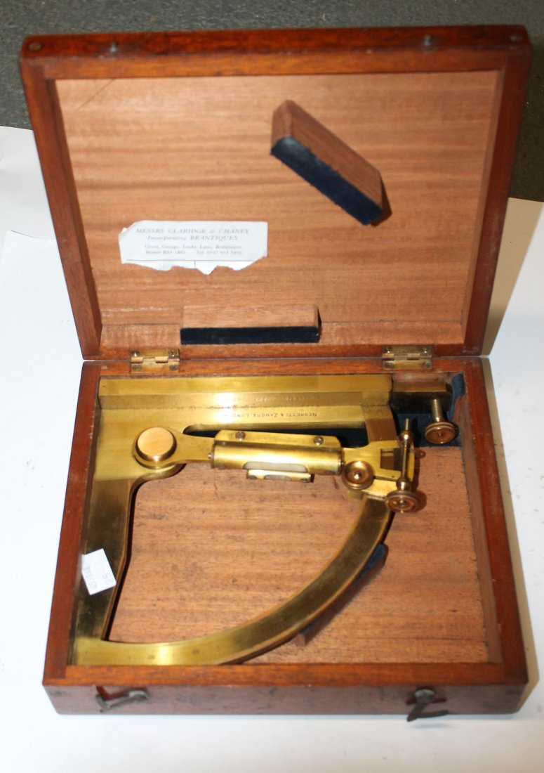 A brass telescope with compass base, W. Ottway 1907, No: A brass telescope with compass base, W. Ottway 1907, No 391, together with a 1940 brass M14 telescope elbow; and a Negretti & Zambra brass instrument in original case, (3).