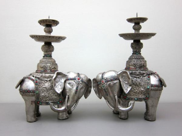 Pair of Tibetan Silver-Clad Altar Figures: Standing elephants with prickets, each inlaid with semi-precious stones, including turquoise, lapis lazuli, jade, feldspar, malachite, and carnelian. Probably circa late 19th/early 20th century. H 18 