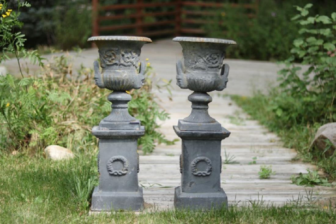 Pair of Iron Urns on Stands (1 of 3)