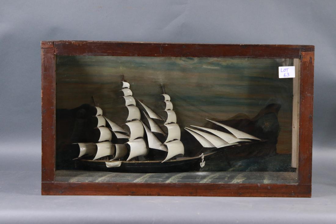 Primitive maritime shadow box: Shadow box ship model showing an American clipper ship under full sail. Glass skylight on case. 30 x 8 x 17