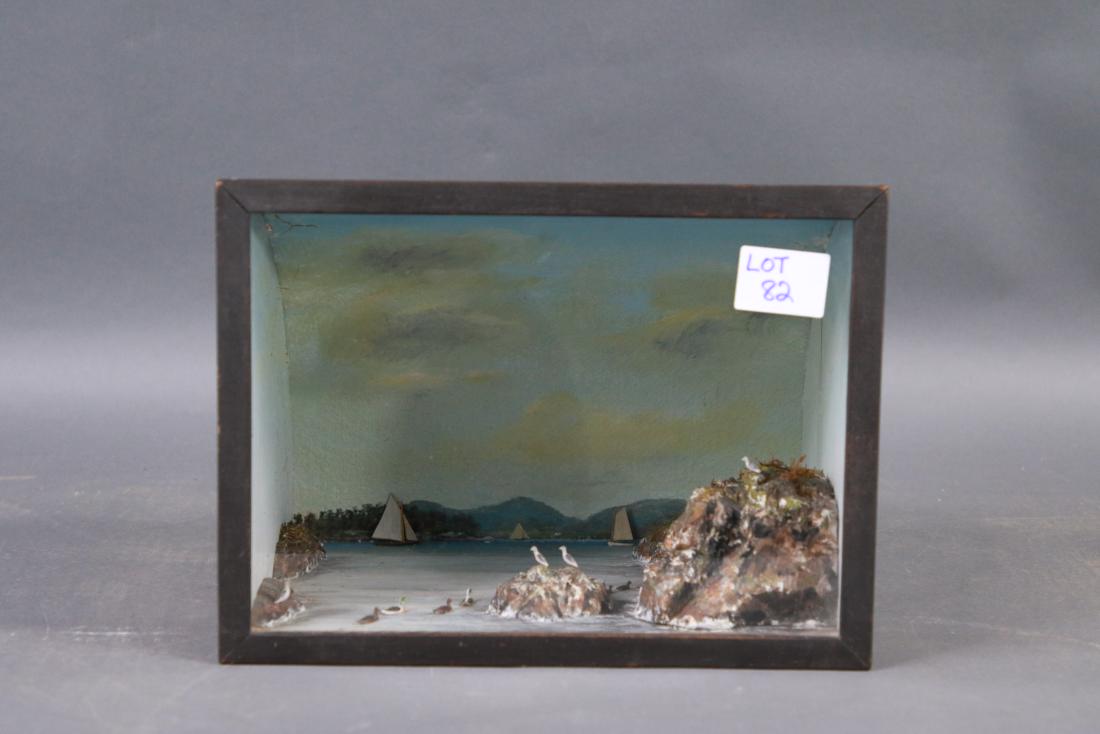 Marine shadow box in curved case.: Detailed and interesting diorama showing rocks, sea birds, sloops, catboat etc.. Set into an unusual shadowbox with curved back. 13 x 9 x 10