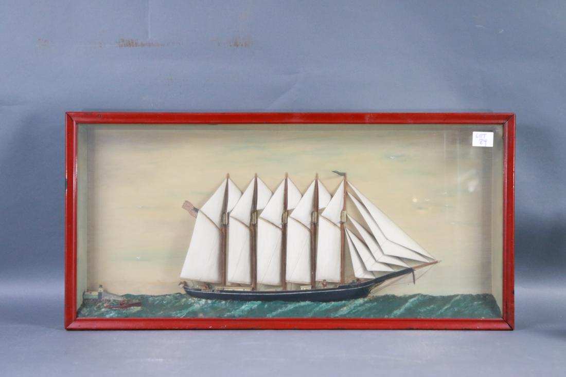 Ship model diorama of a schooner: Five masted ship model of the American schooner Dorothy Cox with varnished deck and painted cabins. Full suit of nineteen carved wood sails. Set into a molded sea. Wood frame. 39 x 3 x 19