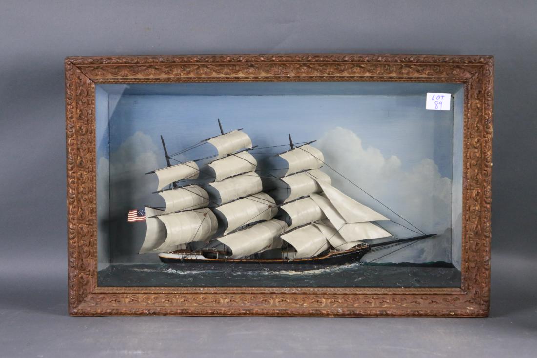 Antique clipper ship shadowbox: Fine, old maritime shadowbox showing an American clipper ship under full sail hoisting sixteen sails. Set into a composite sea. Wood and gesso frame. 32 x 6 x 20