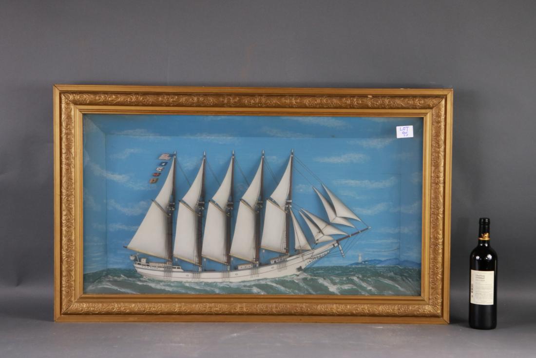 EW PALMER schooner shadowbox: Diorama of the Maine schooner E.W. PALMER . Five masted ship model mounted into a shadowbox. Rigged with a full suit of carved wood sails. Set upon a smooth ocean, background is painted with a blue sk