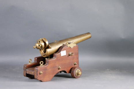 Fine antique brass yachting cannon: A breach loading yacht signal cannon with 18 inch barrel. Fitted to a sturdy two wheeled carriage with all of its brasses. 36 pounds. 22 x 11 x 12