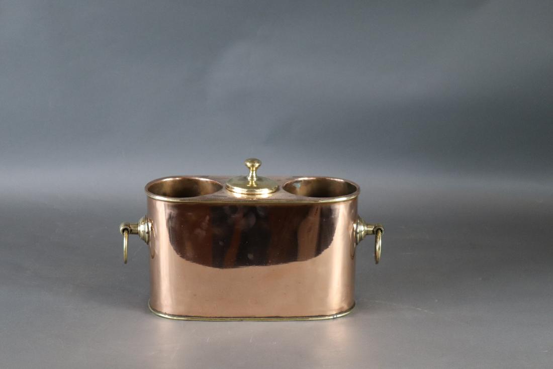 Wine cooler form SS York: Copper and brass wine cooler with SS YORK and LONDON punched into the bezel. With center compartment for ice, two brass ring handles. 15 x 5 x 9