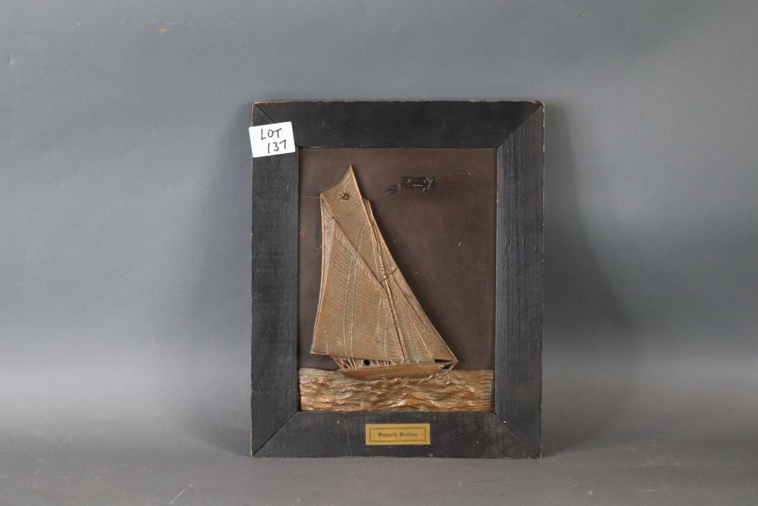 Antique brass yachting placque: Sailing yacht in brass relief under full sail with sea and crew on board. Legend plate reads SMOOTH SAILING fitted to a wood frame. 12 x 15
