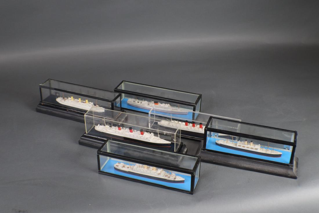 Basset Lowke Ship Model Lot: This lot consists of six cased models including New York, Capetown, Three stacker and a Cunarder Ile de France and Otranto. Longest is 8â€