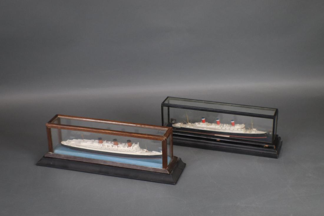 Basset Lowke Ship Model Lot: Pair of Basset Lowke ship mdoels Leviathan and Queen mary ship models by Basset Lowke of England. Fitted to glass cases. Longest model is 10â€