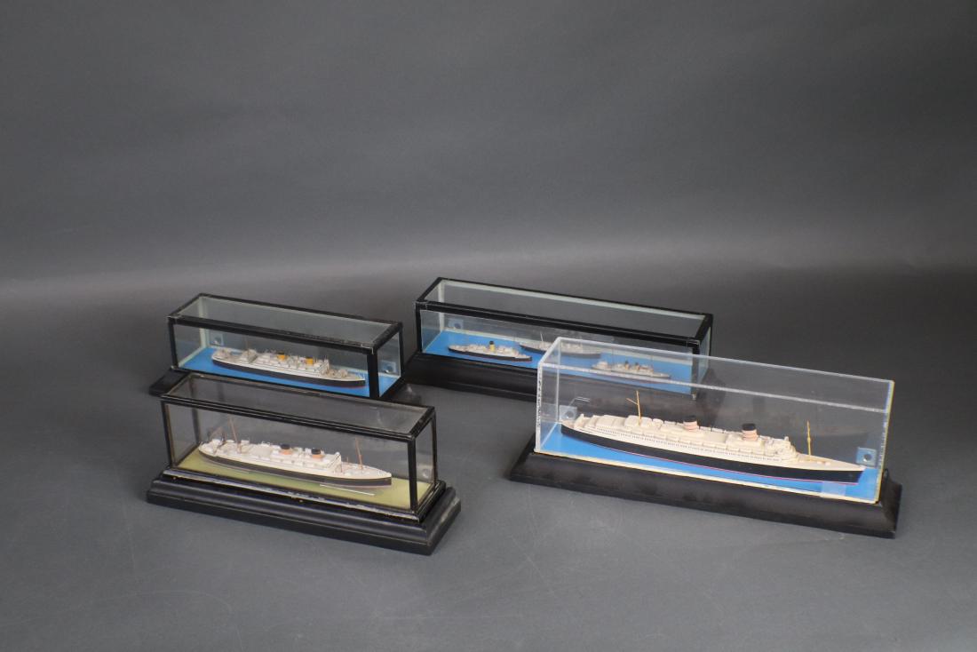 Basset Lowke Ship Model Lot: Six Basset Lowke ship models in cases as a lot. Vessels include Queen Elizabeth, Alcantara, Brittanic along with three in one case which include Lorena, Maid of Kent and Enganine. Longest 10â€