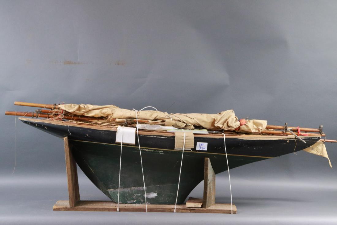 British 10 rater vintage pond yacht: Vintage pond boat in need of restoration. 10 rater class. Mast and boom are present. Sails are a mess. 50 inches long.