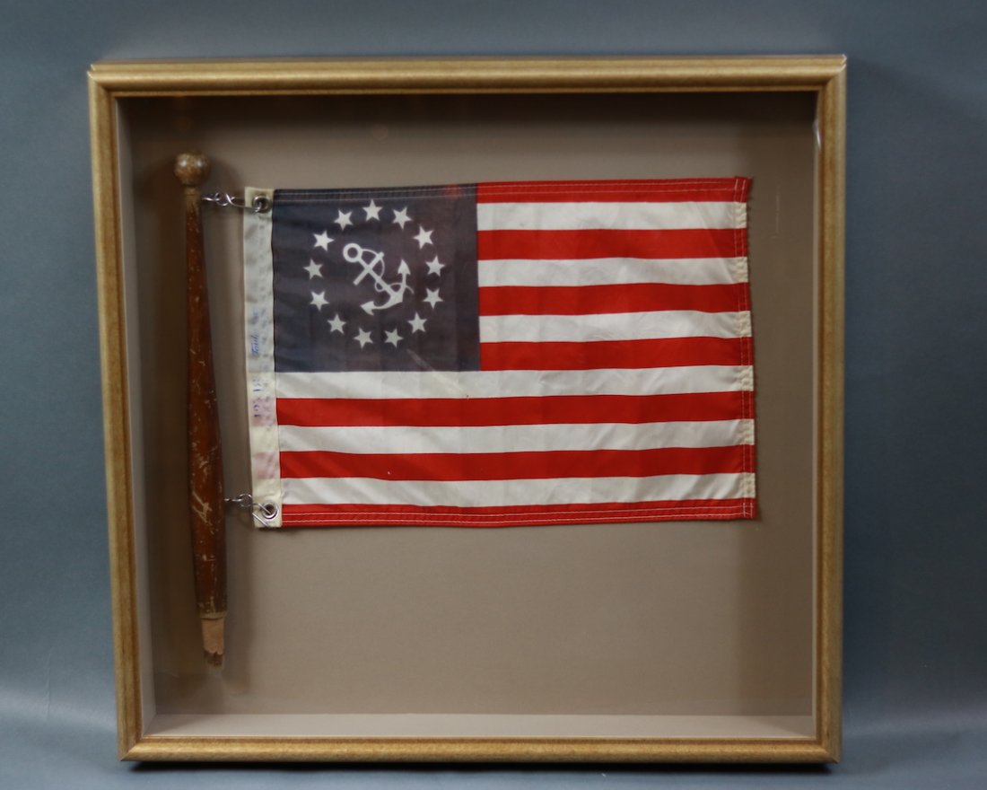 Framed Yacht Ensign in Shadowbox: Old yacht ensign with wooden pole mounted into a shadowbox case wtih glass front. 24 inches x 24 inches x 3 1/2 inches deep.