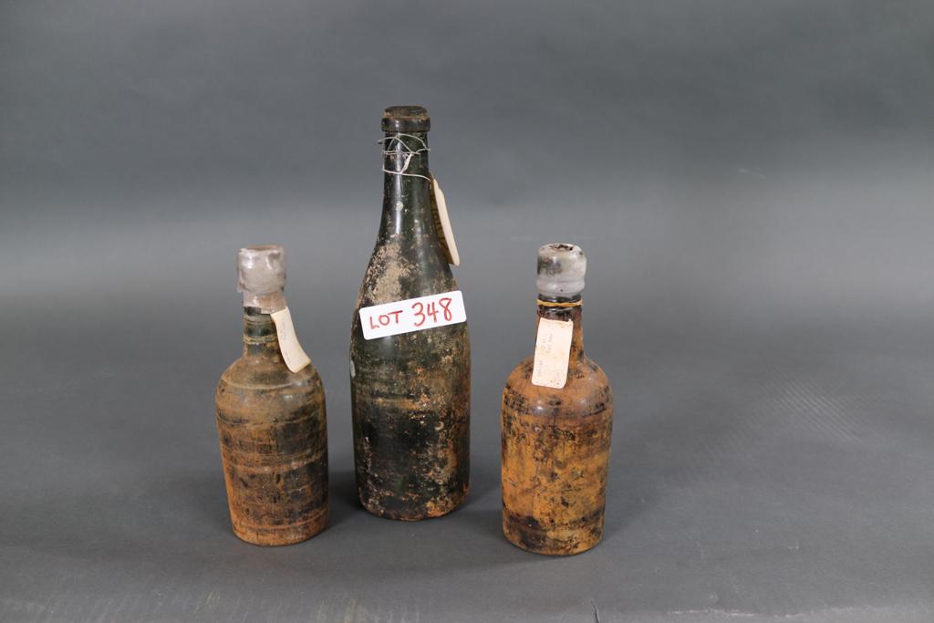 RMS REPUBLC CHAMPAGNE AND BEER BOTTLES: Two beer and a champagne bottle raised from the wreck of the Cunard liner RMS REPUBLIC which sank off Nantucket in 1909. These bottles were raised in 1987, it is thought that the wreck may still conta