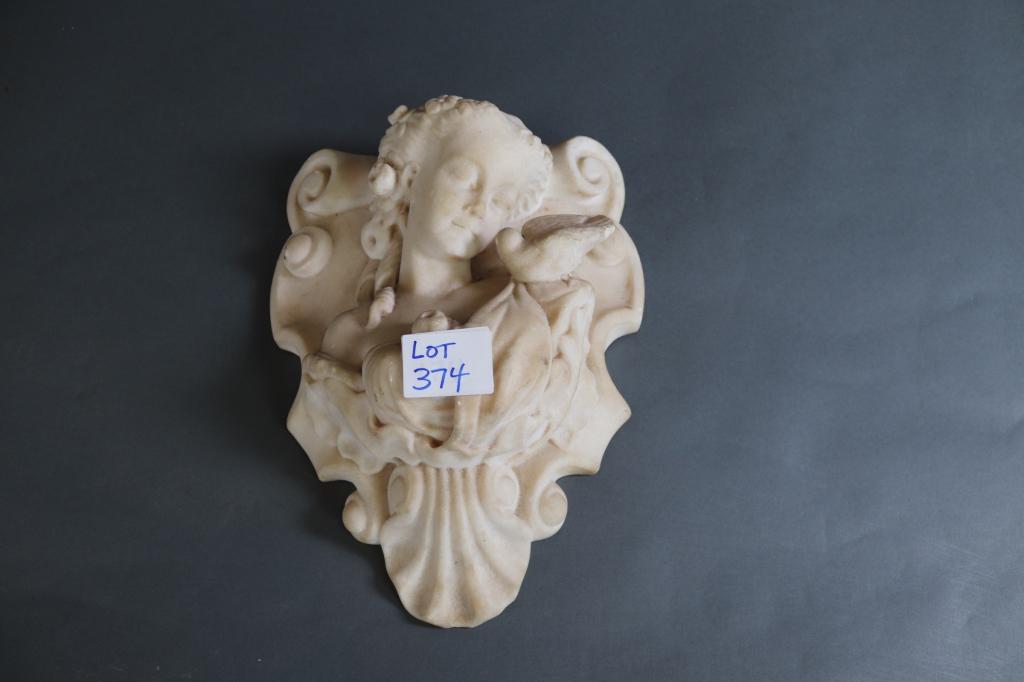 ALABASTER GIRL WITH BIRD SCULPTURE: Alabaster sculpture showing a young girl with bird.