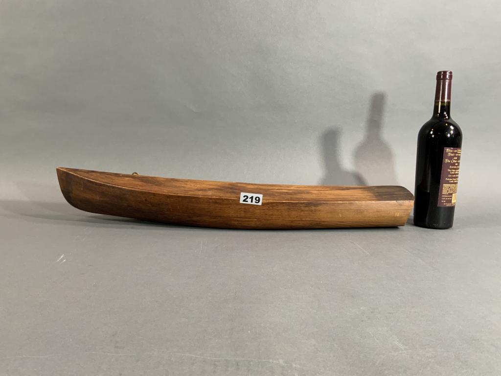 HALF MODEL OF A WOOD YACHT: Antique carved half model of a yacht. Graceful lines. Weight is 4 pounds. 3" H x 28" L x 5" Deep.