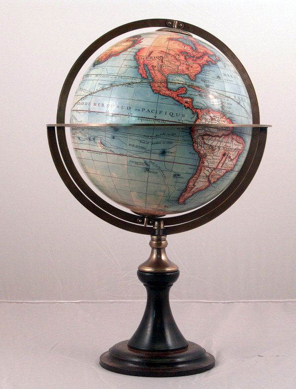 World globe on wood stand.: World globe with solid brass horizon and meridian rings. 17" diameter of sphere x 24" overall height.