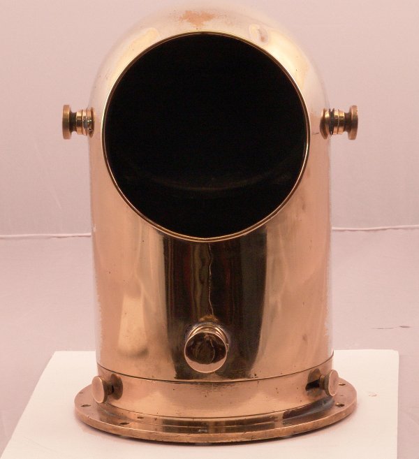 Ship's binnacle mirror.: Solid brass compass binnacle mirror. Housing with a mirror that would reflect the compass card image by the hinged mirror. Binnacle is highly polished. Mirror needs re-silvering. 9" diameter x 13" hig