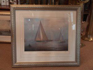 Shamrock V lithograph: "Tim Thompson signed lithograph of Shamrock V with many spectator boats in the distance including steam vessels. Titled ""The Great Yachts"" . Matted and framed. 31"" high x 34"" wide"