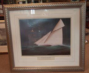 Reliance lithograph: "Framed and matted lithograph by Tim Thompson of the gaff-rigged America's Cup yacht Reliance underway with crew on deck. Signed by the artist. 31"" high x 35"" wide"