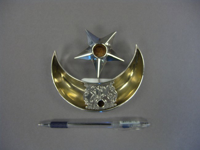 J. Pierpont Morgan's Tiffany cigar cutter: Solid sterling silver cigar cutter ashtray from J. Pierpont Morgan's private yacht "Corsair". It's shape incorporates the crescent moon and star of the Morgan private signal flag that flew at the top 