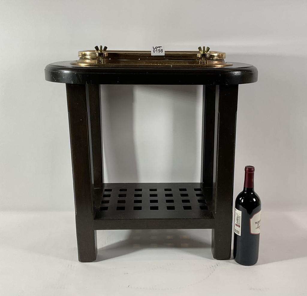 Perko Porthole Now A Table: Antique rectangular yacht porthole by Perko of New York. This piece has been meticulously polished and lacquered. Mounted into a mahogany table with a deck grating shelf below. Four tapered legs. Dime