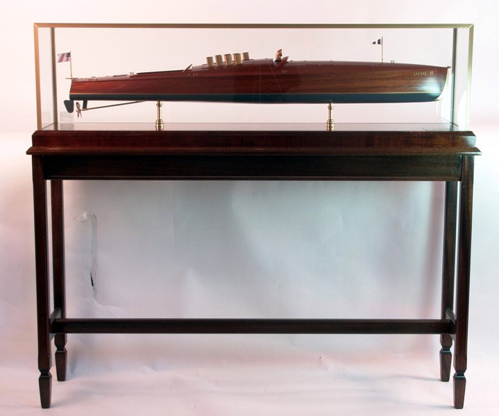 Speedboat Dixie II: Scale Model of the Competition Speedboat "Dixie II". Planked hull with exhaust cowls, controls, cleats, steering wheel, benches, ventilator cowl, and flagstaff with flag mounted in a mahogany display 