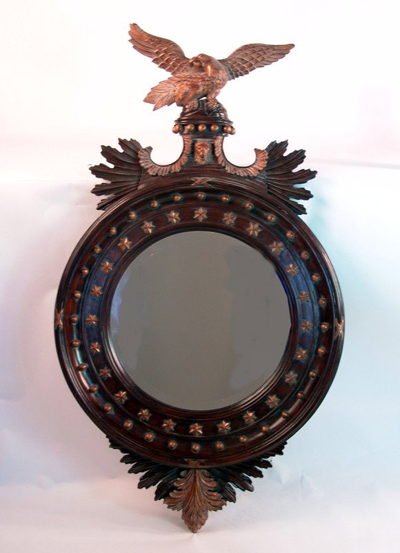 Carved Federal style mirror with eagle: Expertly carved mirror with rich mahogany finish, applied gold stars, detailed outside carving and well carved eagle with outstretched wings. 26" wide x 46" tall