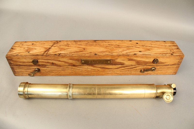 Brass scope in box.: Solid brass sighting scope in oak box with geared focal tube and crosshairs in view. Engraved on the tube Steinphiel in Munchen, No. 7947. 20" closed x 2" diameter.