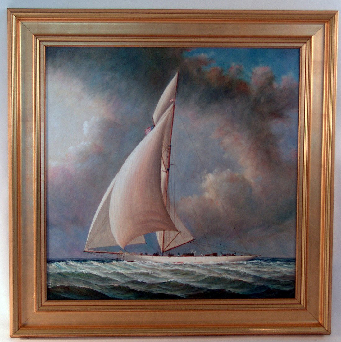 Oil on canvas "Wing to Wing": Oil on canvas of a gaff rigged sloop sailing "Wing to Wing" with boom set 90 degrees to starboard and spinnaker pole set 90 degrees to port. A full crew is on deck. Mounted into a gold painted wood fr
