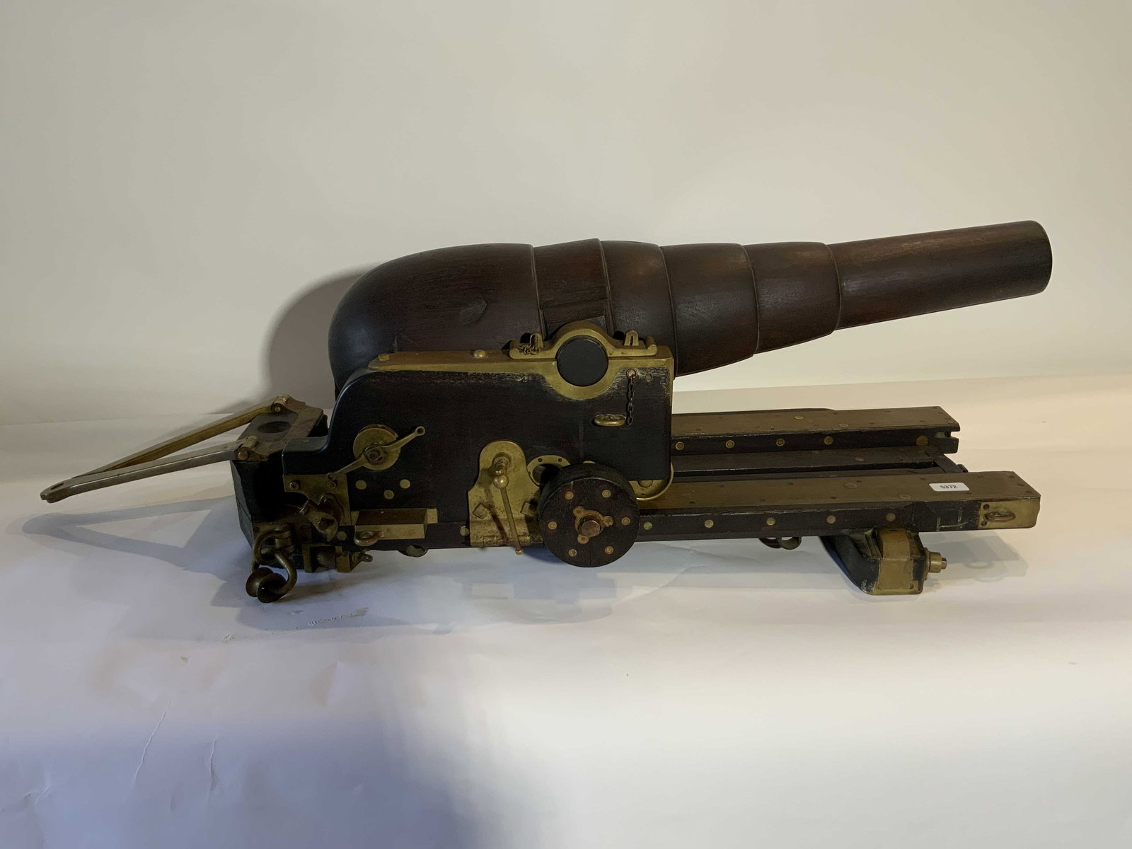 Patent Model of a Dahlgren Style Cannon: Original builderâ€™s model of a 7”, rifled, muzzle loading naval gun of the design of Admiral Thomas Dahlgren. Gun with is 6 1/2 tons; show 2 1/2 tons, carriage, 2 tons. Fires a 115 pound p