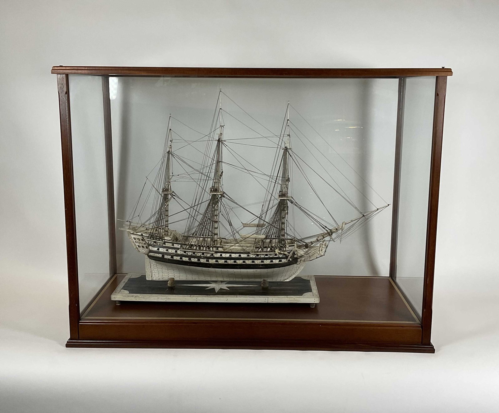 Napoleonic Prisoner of War Ship Model: Napoleonic Prisoner of War Model of a Gunship. Hull is planked in bone and pinned to the hull with trunnions. Stern fitted with elaborate quarter and stern galleries with intricate carving. Carved fig