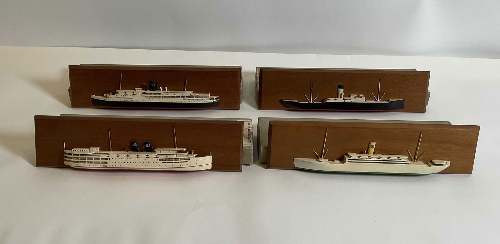 Rare Van Riper of Marthas Vineyard Ship Models: Scarcely found group of four Van Ryper ships half models on custom waterline bases with backboards. The vessel include the Acadia of Eastern steamship lines in company livery and logo on stack. The Bo