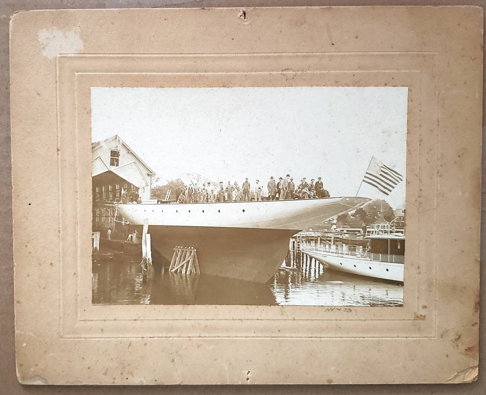 Herreshoff Yacht Yard Launching Photos: Pair of original yacht launching photos of a Herreshoff yacht in Bristol Rhode Island. A huge contingent is seen on deck the second photo shows the vessel in the water without ballast. Twelve are seen