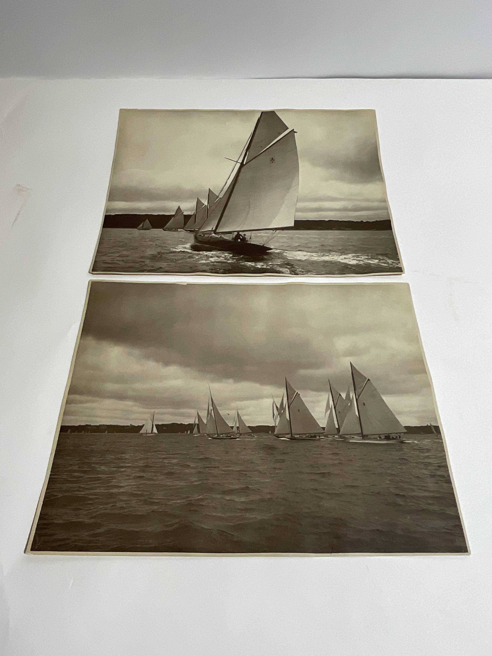 New York Forties Sailing Yacht Photos: Pair of prints showing the New York Yacht Club's One Design Class "New York Forties." Nine Yachts are seen racing under full sail. The second shows New York 40 number #1 with a port stern view with ot