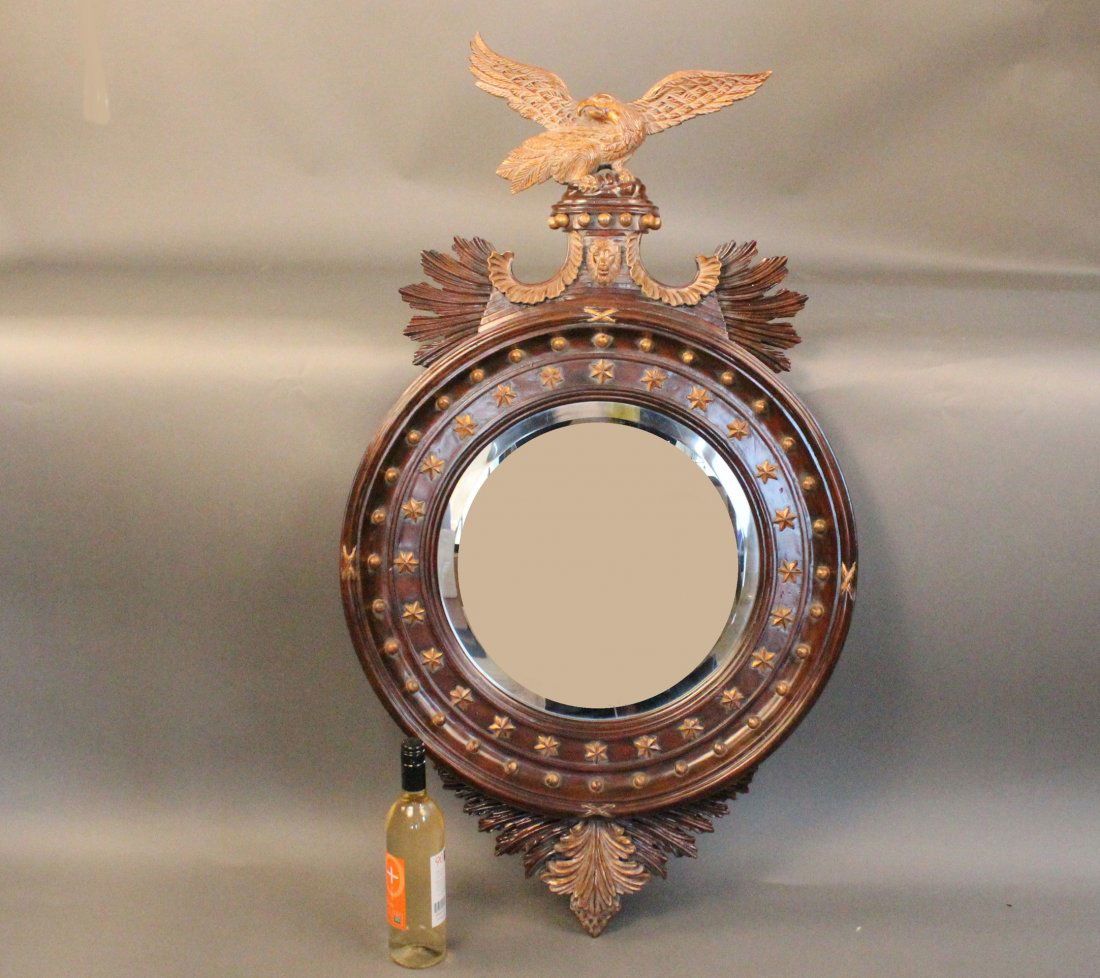 Carved Federal style mirror with eagle: Expertly carved mirror with rich mahogany finish, applied gold stars, detailed outside carving and well carved eagle with outstretched wings. 26" wide x 46" tall