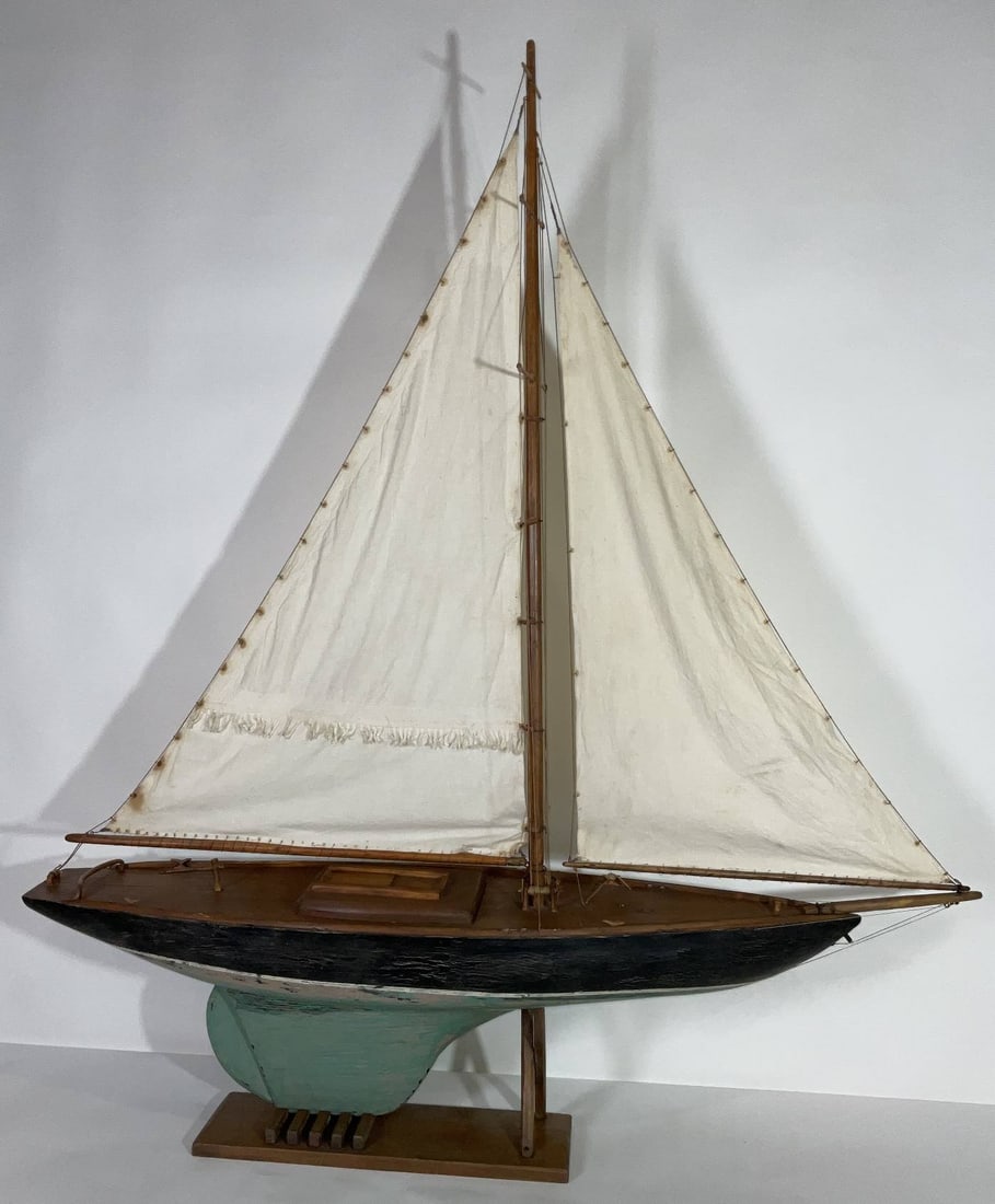 Vintage Pond Yacht Model with Sails: Pond yacht model with a full suit of cotton sails. Wood cradle. 58" H x 50" W x 10" D. 21 lbs.