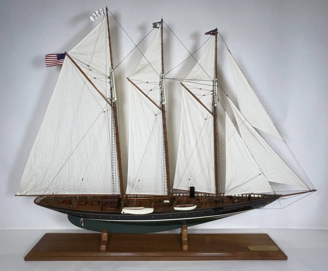 Ship Model of the Schooner Yacht Atlantic: Scale model of the three masted schooner yacht Atlantic. Rigged with a full suit of linen sails. The planked deck carries mahogany cabins with turned brass portholes, hatches, companionways, etc.. Atl
